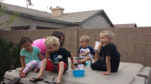 Cousins take a break from play on top of the hot tub!