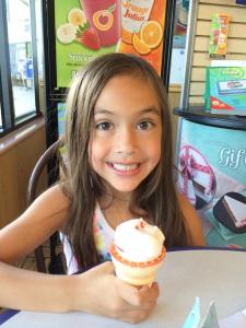 Happy with her ice cream cone.