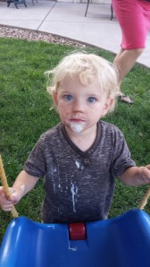 Micah looks a bit like Colonel Sanders after enjoying an ice cream cone.