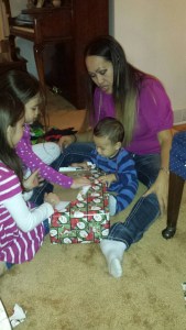 Cole gets help opening his gifts.