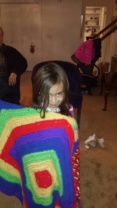 Kaiya loves her new afghan made by Nana!
