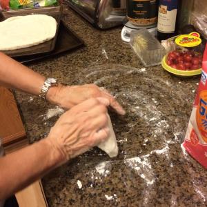kneading pizza dough