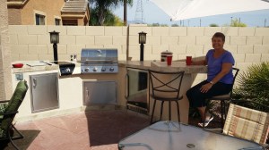 Here I am enjoying an adult beverage at the bar of our spectacular outdoor kitchen!