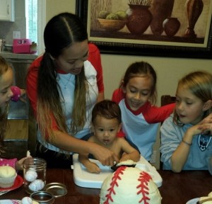Cole at his one-year-old birthday party, getting ready to try his cake.