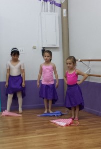 Maggie is singin' and dancin' in the rain.