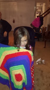 Kaiya is showing off the afghan I made for her last Christmas. She chose the pattern and shockingly selected primary colors rather than pastels!