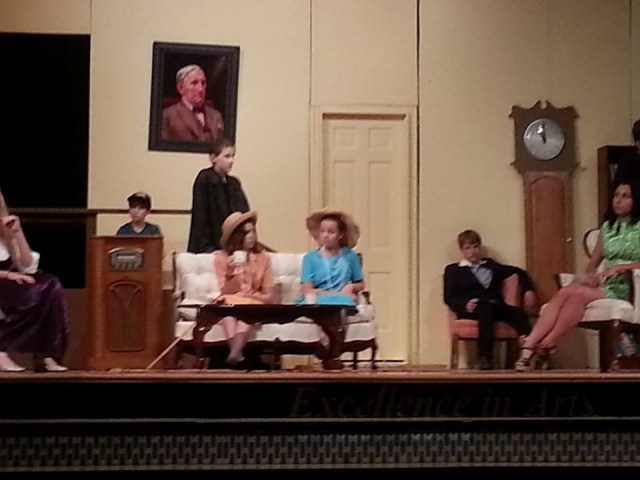 Adelaide (as Dorthella) is wearing blue and a funny hat in keeping with her 60-something character (although I am almost 62 and don't wear hats).