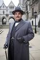 Hercule Poirot as portrayed by David Suchet in the wonderful PBS long-running series.