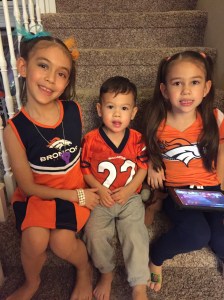 Kaiya, Cole, and Mylee show their Bronco colors.