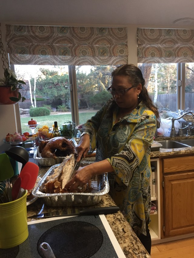 Manith patiently carved both of the turkeys.