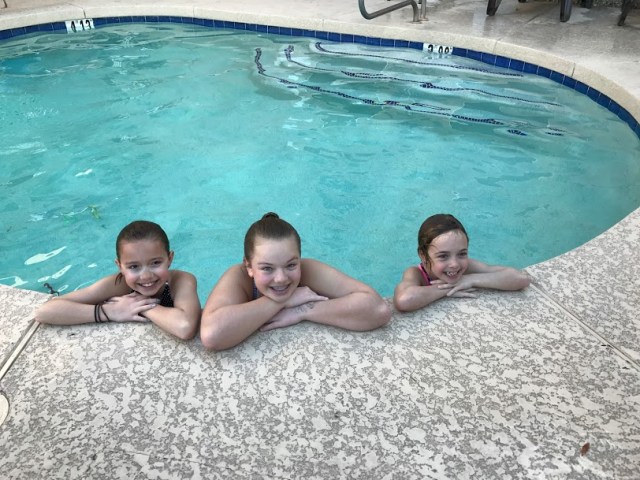 Dagny, Addie, and Maggie Faith enjoy the pool, despite the chilly temps.